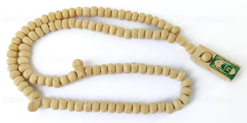 Tasbih prayer beads showing imam marker bead and tassel structure
