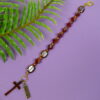 Faceted Burgundy Protestant chaplet bracelet with burgundy glass beads, coppertone accents, cross pendant, and It Is Well With My Soul pendant
