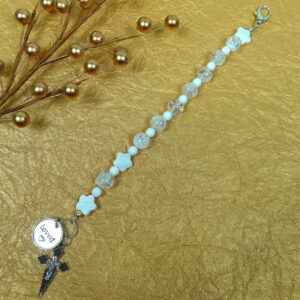 White Protestant chaplet bracelet with white shell flower beads, crackle glass, rhinestone cross, and loved heart pendant