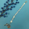White Protestant chaplet bracelet with white shell flower beads, crackle glass, rhinestone cross, and loved heart pendant