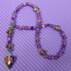 Purple Leaved Heart Protestant prayer beads with purple crackle glass, hematite leaf spacers, and iridescent heart pendant