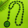 Green Leaves Hematite prayer bead necklace with hematite roller beads, green glass leaf spacers, and floral pendant