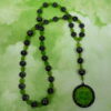 Green Leaves Hematite prayer bead necklace with hematite roller beads, green glass leaf spacers, and floral pendant