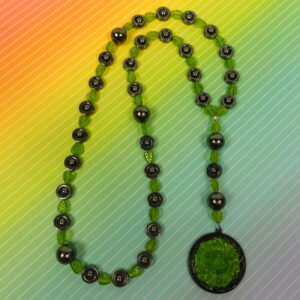 Green Leaves Hematite prayer bead necklace with hematite roller beads, green glass leaf spacers, and floral pendant