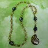 Lime Snails Protestant prayer bead necklace with ceramic snail beads, jade spacers, and abalone shell snail pendant