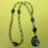 Lime Snails Protestant prayer bead necklace with ceramic snail beads, jade spacers, and abalone shell snail pendant