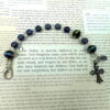 Black Crystal Rainbow Protestant chaplet bracelet with black glass beads, rainbow accents, antique goldtone metal cross, and heart pendant