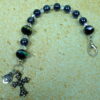 Black Crystal Rainbow Protestant chaplet bracelet with black glass beads, rainbow accents, antique goldtone metal cross, and heart pendant