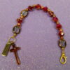 Faceted Burgundy Protestant chaplet bracelet with burgundy glass beads, coppertone accents, cross pendant, and It Is Well With My Soul pendant