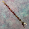 Faceted Burgundy Protestant chaplet bracelet with burgundy glass beads, coppertone accents, cross pendant, and It Is Well With My Soul pendant