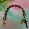 Faceted Burgundy Protestant chaplet bracelet with burgundy glass beads, coppertone accents, cross pendant, and It Is Well With My Soul pendant