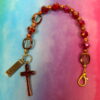 Faceted Burgundy Protestant chaplet bracelet with burgundy glass beads, coppertone accents, cross pendant, and It Is Well With My Soul pendant