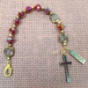 Faceted Burgundy Protestant chaplet bracelet with burgundy glass beads, coppertone accents, cross pendant, and It Is Well With My Soul pendant