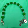 Green Butterflies Protestant chaplet bracelet with green butterfly beads, silvertone metal cross, and Love pendant