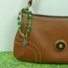 Green Butterflies Protestant chaplet bracelet with green butterfly beads, silvertone metal cross, and Love pendant