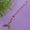 Pink Roses Protestant chaplet bracelet with rose ceramic beads, pink cat’s-eye glass, goldtone metal cross, and BE STILL AND KNOW pendant