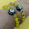 Protected Yellow Evil Eye Protestant Prayer Bead Bracelet with lampworked Evil Eye beads, rhinestoned cross, and PROTECTED pendant