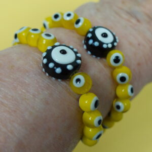 Protected Yellow Evil Eye Protestant Prayer Bead Bracelet with lampworked Evil Eye beads, rhinestoned cross, and PROTECTED pendant