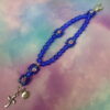 Rosy Blue Protestant Prayer Bead Bracelet with lampworked rose Cruciform beads, blue glass Week beads, cross, and Love pendant