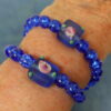 Rosy Blue Protestant Prayer Bead Bracelet with lampworked rose Cruciform beads, blue glass Week beads, cross, and Love pendant