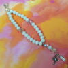 White Believe Protestant Prayer Bead Bracelet with iridescent Cruciform beads, white glass Week beads, filigreed cross, and Believe pendant