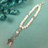 White Believe Protestant Prayer Bead Bracelet with iridescent Cruciform beads, white glass Week beads, filigreed cross, and Believe pendant