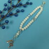 White Believe Protestant Prayer Bead Bracelet with iridescent Cruciform beads, white glass Week beads, filigreed cross, and Believe pendant